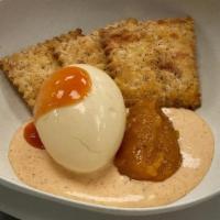 Pickled Egg · Paired with Magical Pils mostarda, hot pickle aioli, and a drop of hot sauce. Served with sa...