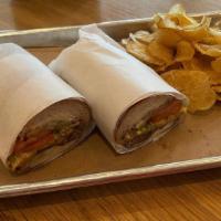 Roasted Beef Po'Boy · Crispy French bread loaded with roasted beef in debris gravy. Served. with pickles, tomatoes...