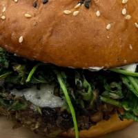 Hippie Burger · Veggie burger made with black eyed peas, black beans, and seasonal. vegetables. Served with ...