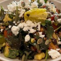 Southwest Kale Salad · Baby kale, romaine lettuce, black-eyed peas, roasted corn, and cherry. tomatoes, finished wi...