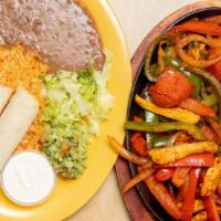 Fajitas · A  tasty  sizzling fajitas platter with choice of beef, chicken or shrimp.