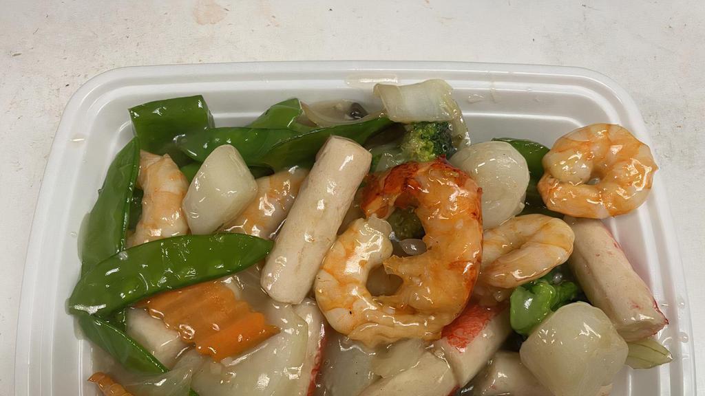 Seafood Delight · Lobster meat, imitation crab meat,  shrimp,  and scallops  sautéed with mixed vegetables in white wine sauce.