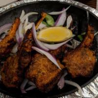 Amber Spice Chicken Wings · Deep-fried crunchy delicious chicken wings sprinkled with Sam's special blend of spices. Ser...