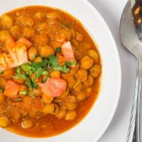 Channa Masala · Fresh chickpeas cooked in an onion and tomato gravy. A thick, tangy, spiced and deeply comfo...