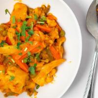Vegetable Jalfrezi · Indian style marinated mixed vegetable stir-fried in a bold and spicy onion and tomato gravy...