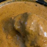 Butter Chicken · Chicken marinated in cream, yogurt and spices, tandoored, then folded into a rich, creamy, m...