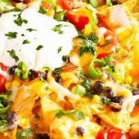 Nachos · Choice of meat+
Tortilla Chips, beans, cheese, guacamole, lettuce, pico
