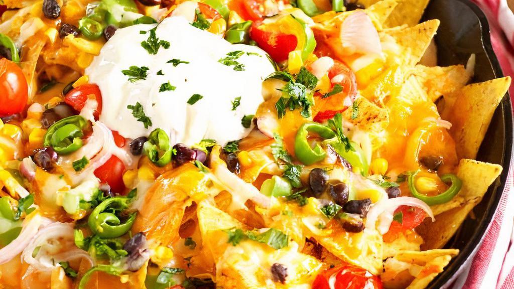 Nachos · Choice of meat+
Tortilla Chips, beans, cheese, guacamole, lettuce, pico
