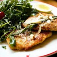 Chicken Milanese · Breaded chicken breast pan-seared and seasoned with lemon zest & garlic, topped with parmesa...