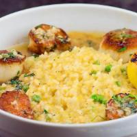 Scallops Meunière · Scallops sautéed to perfection with butter, shallots, garlic, and lemon. Served over buttern...