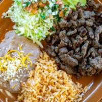 Carne Asada Plate · Carne asada with lettuce, guacamole and salsa Mexicana. Served with rice and refried beans. ...