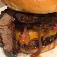Boss Burger · Toasted brioche bun, kickin' bourbon ,fried onion straws, Crispy bacon, shaved beef rib, two...