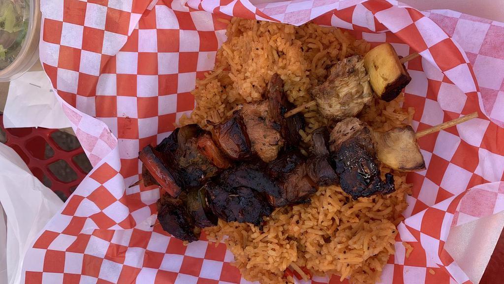 Marinated Chicken Kabobs · Juicy chicken skewered with onions, mushrooms, bell peppers, zucchini, and tomato grilled over our wood fired. Served with cilantro rice.