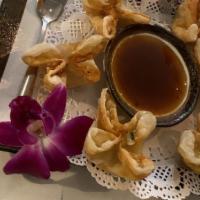Crab Rangoon (6) · Crab and cheese mix wrapped wonton fried and served with sweet sauce.