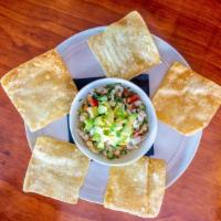 Shrimp & Crab Ceviche* · Cucumber, tomato, chilies, carrot, avocado, hearts of palm, crispy wontons and citrus broth.