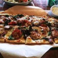 Paradise Pie · House white sauce, four cheese blend, spinach, pepperoni, crumbled Italian sausage, mushroom...