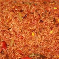 Jollof Rice · Rice dish cooked in a flavorful tomato-based broth mixed veggie bay leaves and other herb