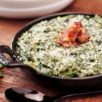 Creamed Spinach · Spinach complimented by our creamy Bacon Béchamel, chopped onions, garlic and Pecorino cheese.