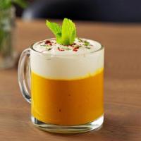 Carrot Ginger Soup | Gf Ve · A creamy carrot ginger soup topped with a lemongrass and mint cream.