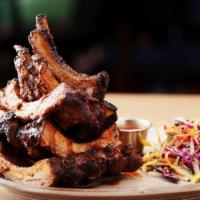 Mesquite-Grilled Baby Back Rib Tower | Gf · Homemade BBQ sauce basted on the ribs and complemented by a multi-color slaw with a light, c...