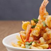 Salt & Pepper Shrimp | Gf · 8 jumbo shrimp breaded in a seasoned flour and fried. Tossed with Szechuan peppercorn, Fresn...