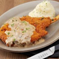 18 Oz. Long Bone Chicken-Fried Pork Chop · (Cowboy Style): Pork Chop seasoned, breaded and fried. Topped with a homemade sausage gravy,...