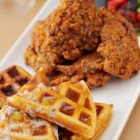 Chicken & Waffles · Buttermilk-fried crispy Cornish hen with vanilla waffles, apple syrup and fruit trio.
