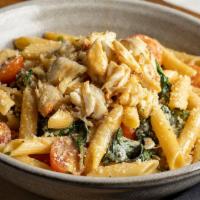 Spinach & Jumbo Lump Crab Pasta · Prepared with tomato, shallot and garlic and finished with herbed butter.