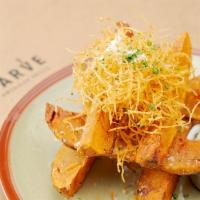 Truffle Steak Fries  · Potato wedges fried, seasoned and topped with truffle oil, potato haystack and Parmesan chee...