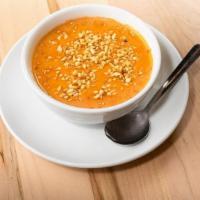 Cup Spicy African Peanut · Creamy Peanut soup garnished with toasted peanuts
