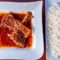Red Stew & Rice · White rice and red stew served with plantains and choice of meat.