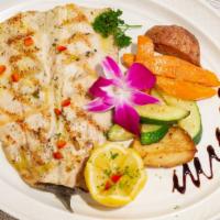 Truta Grelhada · Grilled rainbow trout served with lemon butter sauce and vegetables.