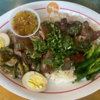 Khao Kha Moo · Slow-braised pork legs, boil eggs, mustard green pickles, Chinese broccoli, mixed herbs (gar...