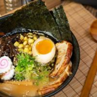 Tonkotsu Shoyu Ramen · Skinny Noodle with Chashu, Soft-boiled Egg, Fish cake, Scallion, Nori Bamboo shoots, and Woo...