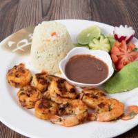 Camarones A La Plancha / Grilled Shrimp · Una porción de camarones jumbo asados, acompañado con arroz, frijoles, ensalada, queso , agu...