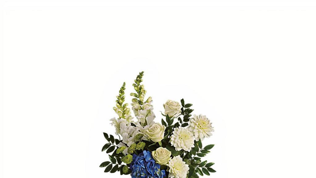 Ocean Devotion · Sending this brilliant blue and white bouquet will surely garner oceans of appreciation from whoever receives it. Dazzling blue hydrangea, green roses and button spray chrysanthemums, divine white dahlias and snapdragons plus huckleberry arrive in a striking cobalt vase.
