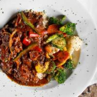 Oxtails · Chicken, steak. 1lb of Smoked Oxtails Served over White Rice with Gravy.