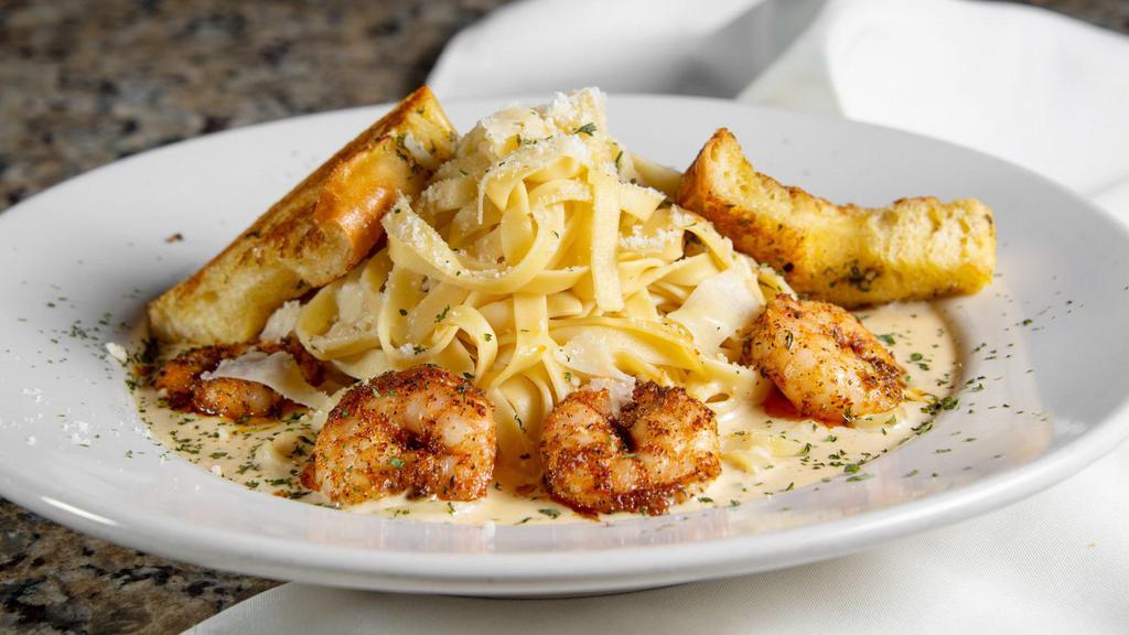 Alfredo Pasta · Fettuccine Pasta and House Made Alfredo Sauce with a side of Toasted Garlic Bread.