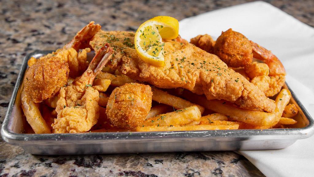 Catfish Platter · Catfish. 2 Large Golden Fried Catfish Fillets served with 3 hush puppies, Seasoned Fries and a side of Tartar Sauce (Cocktail and Hot Sauce available upon request).
