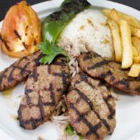 Grilled Kofte · Quality chopped lamb and beef served with spices, parsley, rice,  greens, grilled tomato and...