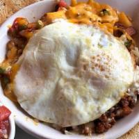 Chorizo Skillet · Two eggs topped with chorizo sausage, onion, mixed peppers, tomato, jack and cheddar cheese....
