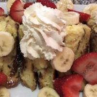 Stuffed French Toast · Mixed fruits and your choice of custard or nutellla filling topped with pecans.