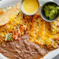 La Familia Grande Plate · A tour of la familia's favorites. One crispy beef taco, one tamale, one cheese enchilada wit...
