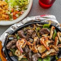 Parrillada · A mixed grill of jumbo shrimp, chicken and beef fajita. These items may be served raw or und...