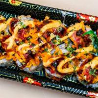 Volcano Roll · California Roll (imitation crab, cucumber, avocado inside) cut into 8 pieces and topped with...