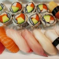 Sushi Deluxe # 23 · 8 pieces of fresh masago California roll with 9 pieces of assorted nigiri sushi.