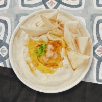 Hummus Plate · A mixture of mashed garbanzo beans, lemon juice and tahini, and garlic served with pita bread.