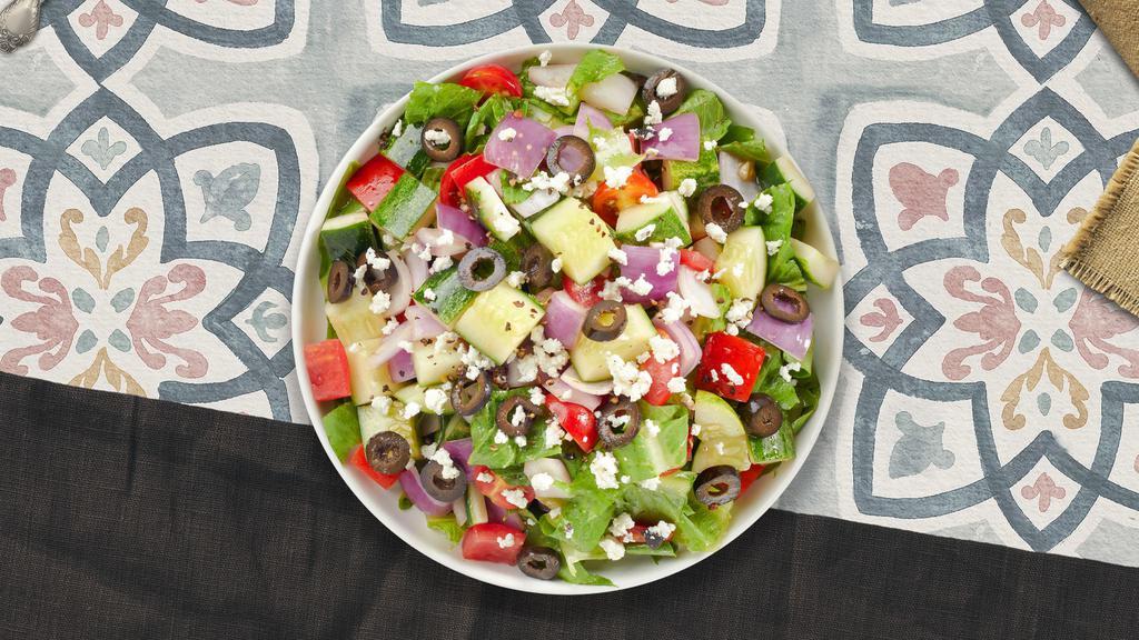 Going Greek Salad · Spring salad mix, tomatoes, cucumbers, onions, feta cheese, and olives tossed with salad dressing.