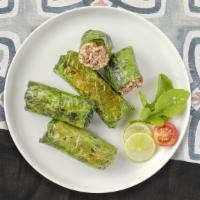 Daily Dolmas · (Six pieces) Grape leaves are stuffed with meat, herbs and rice mixture.