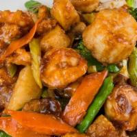 Happy Family · Chicken, shrimp, pork, scallops mixed with vegetables in a delicious brown sauce.